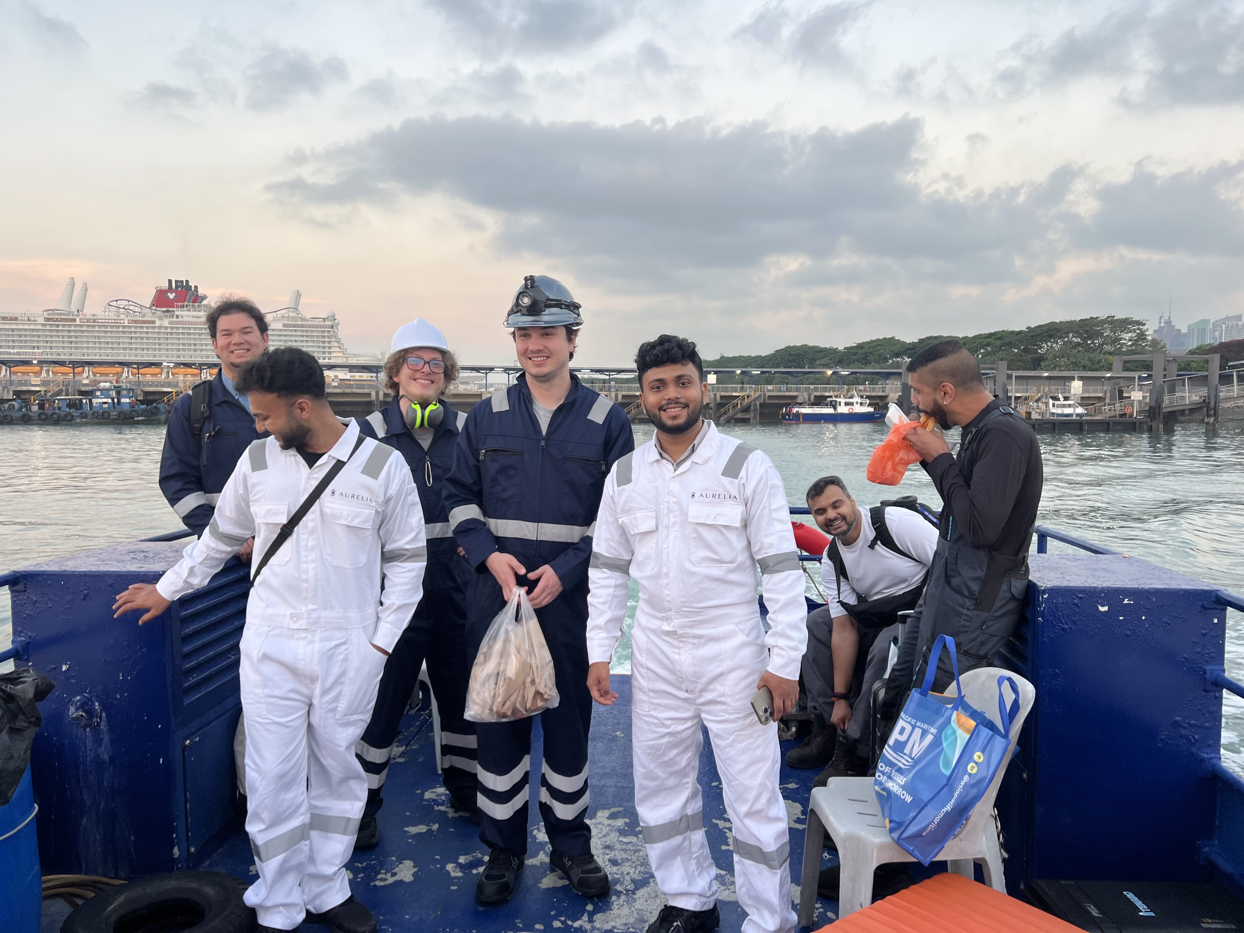Newlight and vessel engineering teams returning from a commercial vessel